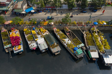 Aerial view of floating flower market in Saigon or Ho Chi Minh City in Vietnam. The market on the Te Canal is open for the Tet Holiday or Lunar New Year.