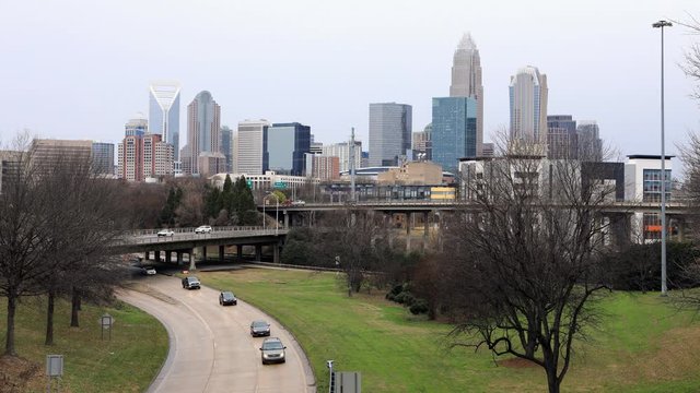 Timelapse of Charlotte, North Carolina skyline with expressway 4K