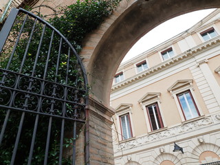 Ferrara, Italy. Elegant palace detail and open gate.