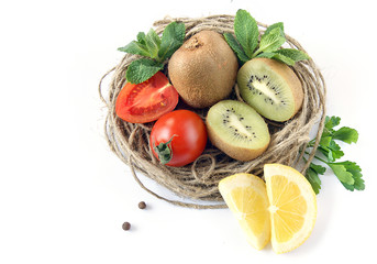 Composition of fruits and vegetables with wicker craft basket.