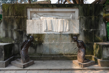 Restored monument for Dead Soliders and kneeled Statue of Betrayer Wang Jingwei in the Anti-Japanese War at Ciqikou, ancient town on west band of Jialing River, Shapingba, Chongqing, China.