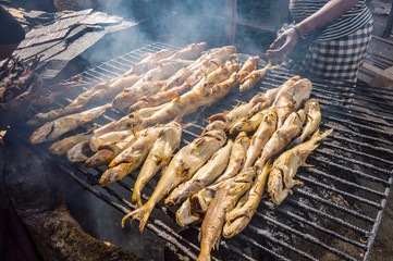 Smoking fish on a grill using charcoal
