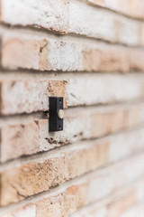 door bell brick wall