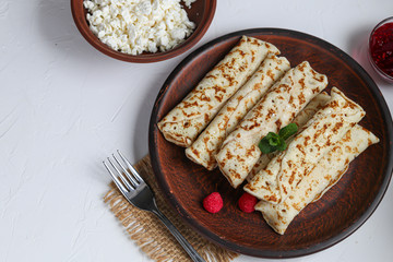 Pancakes with homemade cottage cheese. Sour-milk fermented product. Healthy, delicious breakfasts. With sour cream and raspberry jam.