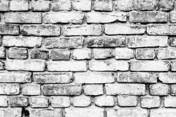 Texture of a brick wall with cracks and scratches which can be used as a background