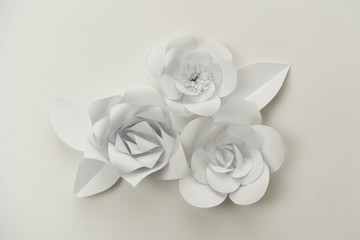 Hand crafted paper flowers bouquet on white. Closeup minimalistic flowers.