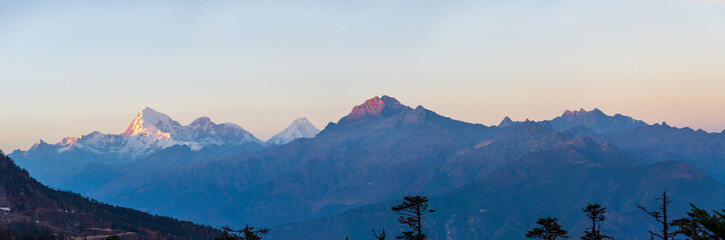 Fototapeta na wymiar Chele La pass in Bhutan at sunset with view on Mount Jumolhari