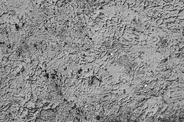 Texture of a concrete wall with cracks and scratches which can be used as a background