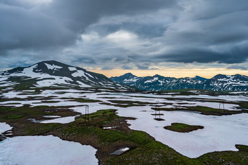 Panoramic view of the city Petropavlovsk-Kamchatsky and volcanoes: Koryaksky Volcano, Avacha Volcano, Kozelsky Volcano. Russian Far East, Kamchatka Peninsula.