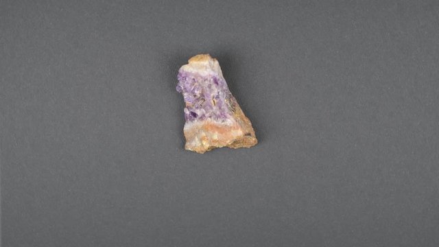 Crystals of amethyst  rotating on black  background