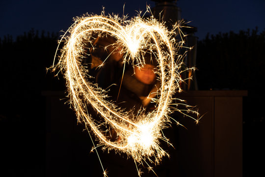 Heart Sign painted with Sparkler - Powered by Adobe
