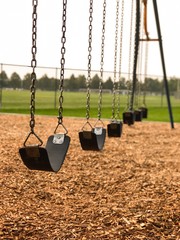 Empty swing set - early morning at the park  