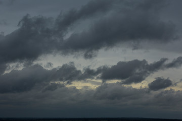 Fototapeta na wymiar Thunderstorm hard clouds above the horizon.