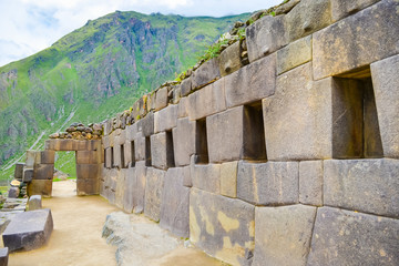 Ancient wall and arch of Ollantaytambo ruined town in Peru