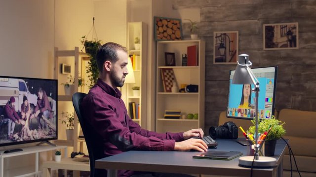 Photographer working on photos from home office