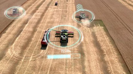 Autonomous transportation in agriculture. Self-driving harvesters ride on wheat field and harvest. Aerial view - Powered by Adobe