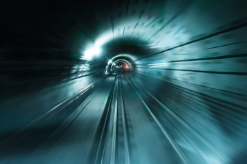 Dark underground tunnel with blurred light tracks