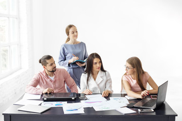 Young students are studying new material for the exam. The concept of entrepreneurs, success and work.