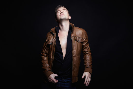 Fashionable young Man in leather coat