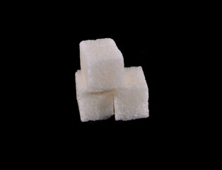 sugar cubes isolated on black background