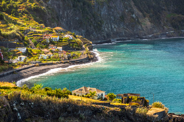 View on the village of Porto Moniz on the Portugese island of Madeira in summer - obrazy, fototapety, plakaty