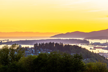 View of ocean sunset over mountains in beautiful British Columbia. Canada.
