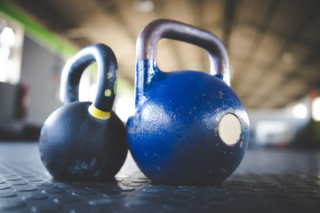 Naklejka na ściany i meble Close up image of kettle bell weights in a gym