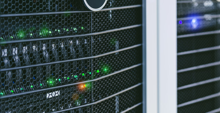 Server units in cloud service data center showing flickering light indicators for massive data connection bandwidth, close up shot.