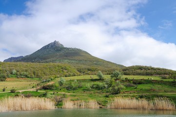 Fototapeta na wymiar Lake and village among the mountains