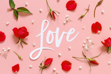 Red flowers and text LOVE on a light pink background