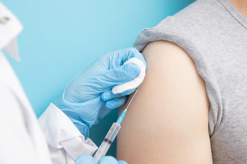 Nurse gives vaccine against illness injection corona virus to man. Concept stopping epidemic