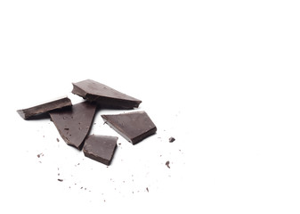 pieces of dark chocolate isolated on white background