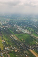 Crop fields and agricultural plantations on a rural area. Aerial view.