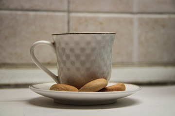 coffee glass on a plate with cookies