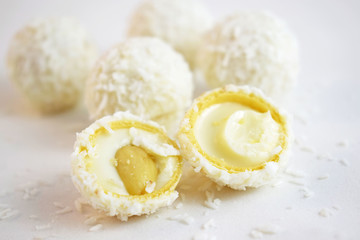 Coconut candy with nuts isolated on a white background.