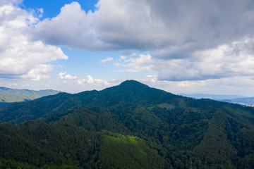 Aerial landscape of mountain and blue sky with cloud at Doi Mae U Kho, Khun Yuam, Mae Hong Son, Thailand