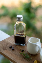 Espresso coffee in glass bottles, Served with a small glass of syrup to reduce the bitterness of coffee.