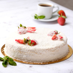 Homemade delicious sweet strawberry cake with red berries on cup of coffee americano, white background. Organic dessert sugarless. Healthy eating.
