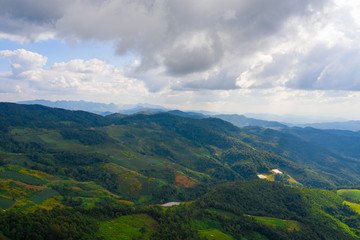 Aerial landscape of mountain and blue sky with cloud at Doi Mae U Kho, Khun Yuam, Mae Hong Son, Thailand