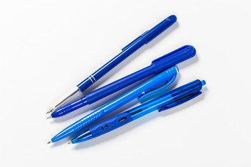 Collection of multi-colored ballpoint pens isolated on a white background