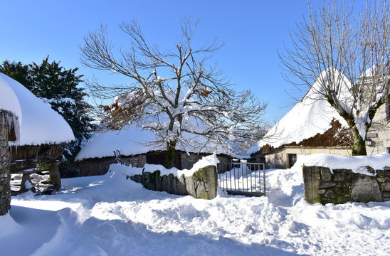 Famous Piornedo snowy mountain Village with ancient Palloza round houses made with stone and straw. Ancares, Lugo, Galicia, Spain.