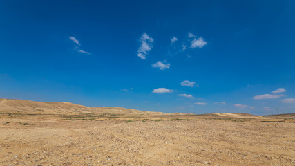 Fototapeta na wymiar White panorama of desert with a white clouds