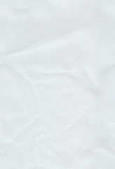 Slightly wrinkled paper. Seamless pattern with a white crumpled paper texture and stretched again.
