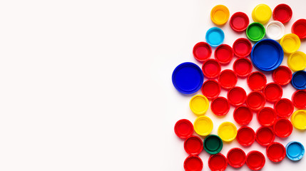 Colored covers from plastic bottles isolated on white