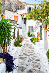 The streets of the ancient district of Athens - Plaka, the narrow old streets, shutters, many green plants