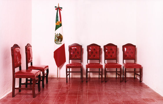 Interior of red chairs with Mexican flag