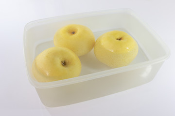 Asian pear or Nashi pear soak in water. White background