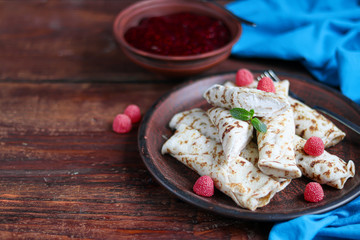 Pancakes with homemade cottage cheese. Sour-milk fermented product. Healthy, delicious breakfasts. With sour cream and raspberry jam.