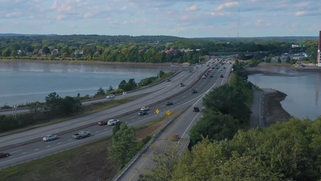 Aerial: Freeway traffic on the 295 crossing the Back Cove. Portland, Maine, USA