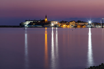 Night view of Budva old town and harbour, Montenegro. City skyline.